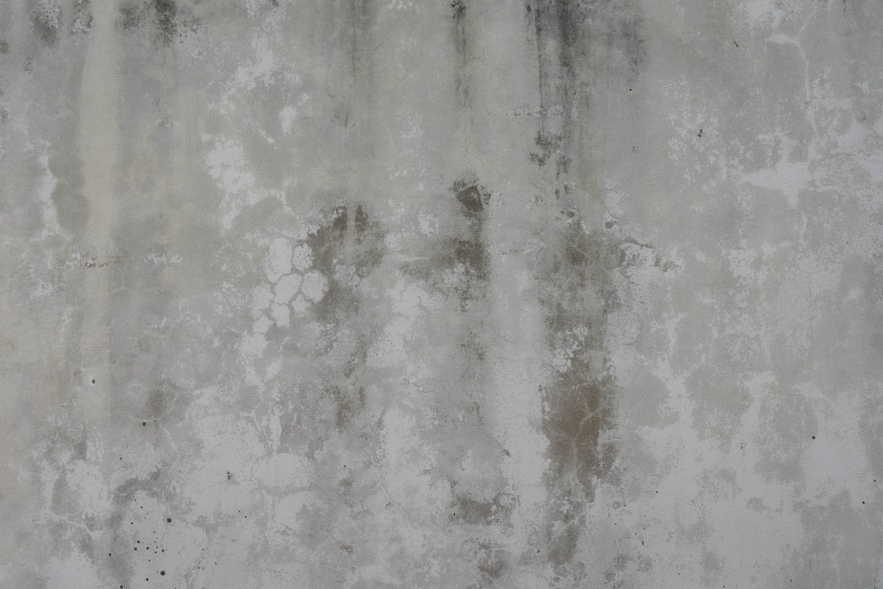 FULL FRAME SHOT OF WEATHERED WALL WITH METAL