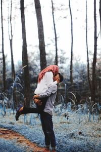Couple romancing in forest