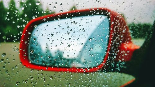 Close-up of raindrops on glass window