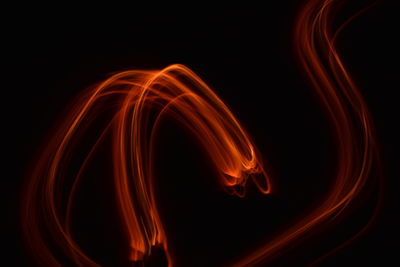 Close-up of light trails against black background