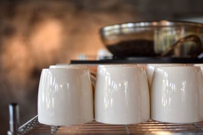 Close-up of cups on table