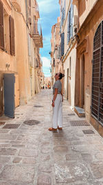 Rear view of woman walking on street