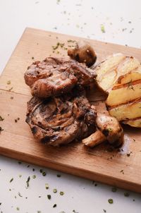 High angle view of meat on cutting board