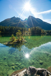 Scenic view of lake and mountains against sky