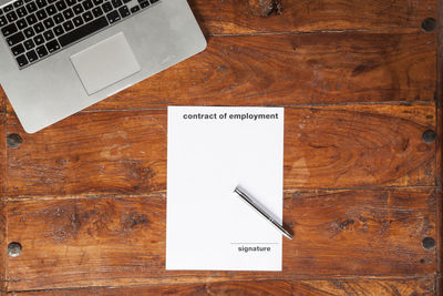 High angle view of information sign on table