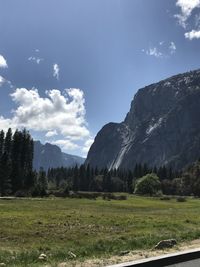 Scenic view of landscape and mountains against sky