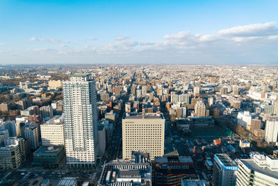 High angle view of city buildings against sky