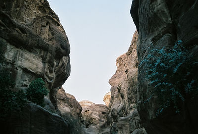 Low angle view of rock formation against clear sky