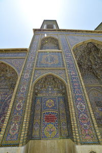 Low angle view of ornate building against sky