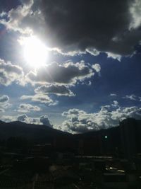 Scenic view of mountains against cloudy sky