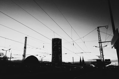 Low angle view of electricity pylon against sky