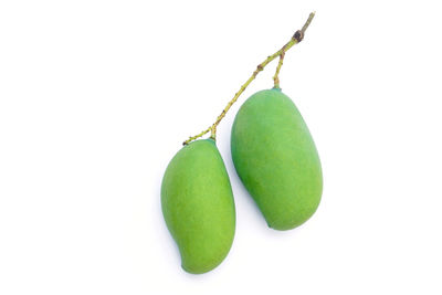 Close-up of fruit against white background