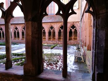 View of historic building seen through window