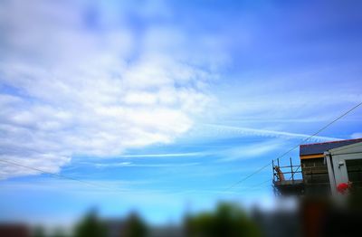 Low angle view of built structure against blue sky