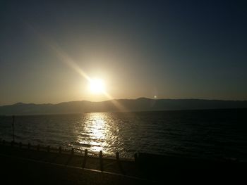 Scenic view of sea against clear sky during sunset