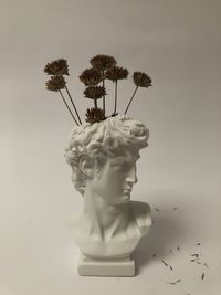 Close-up of statue against white background