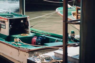 Close-up of boats moored at harbor