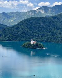 Scenic view of the bled lake  and mountains against sky