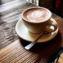 High angle view of coffee cup on table