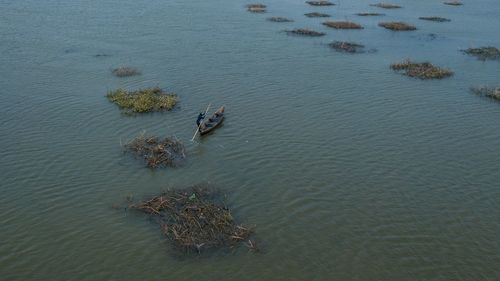 High angle view of man on boat sailing in sea