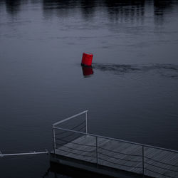 High angle view of red boat on lake