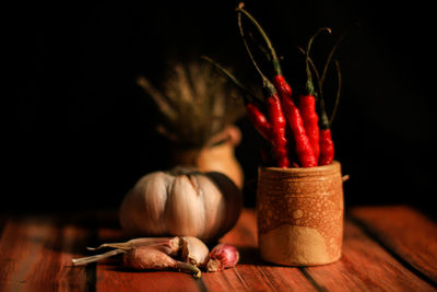 Close-up of red chili peppers on table