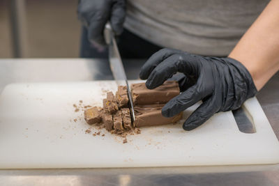 Low section of man washing hands