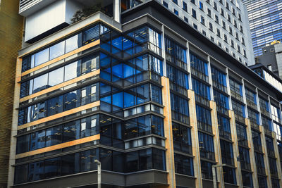 Low angle view of modern buildings in city