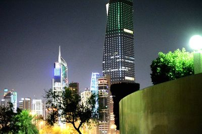 Low angle view of illuminated cityscape