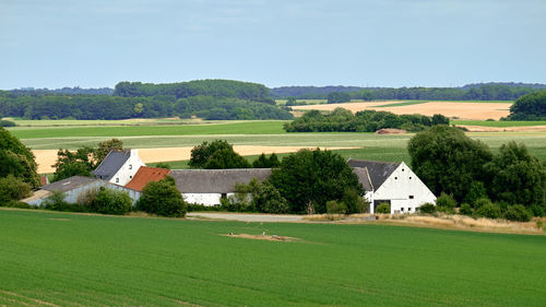 House on field against sky