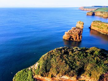 High angle view of rocks in sea