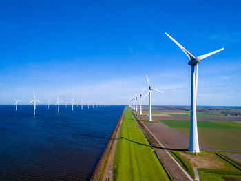 Scenic view of sea against blue sky