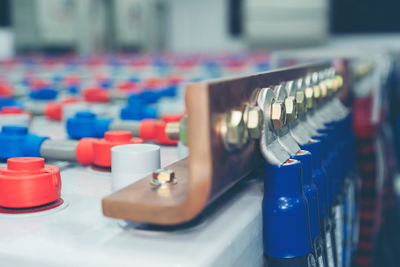 Close-up of multi colored bottles on table