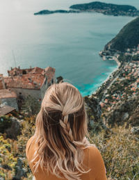 Rear view of woman looking at sea