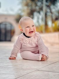 Portrait of cute girl sitting 