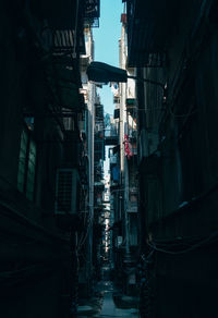 Low angle view of road amidst buildings in city