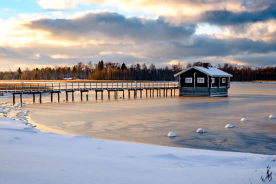 Scenic view of frozen lake against sky during winter