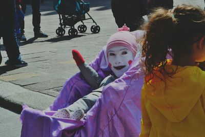 Girl with people in background