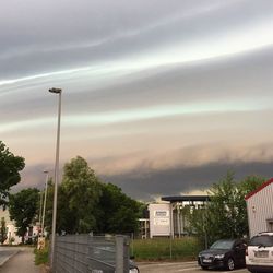 Cars on road against sky