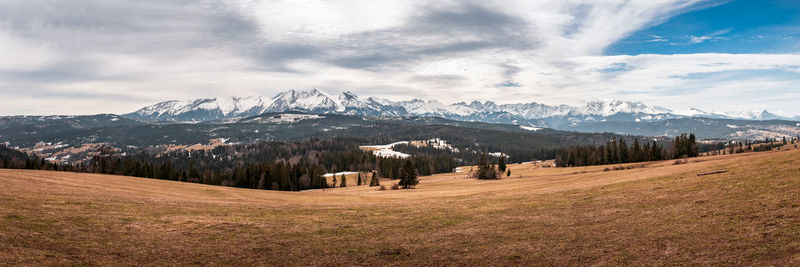 Early spring. snow-covered peaks of the tatras, melting snow in the mountain pastures.