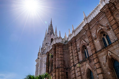 Low angle view of traditional building against blue sky