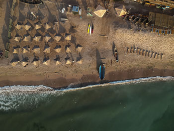 Aerial view of beach umbrellas on seashore