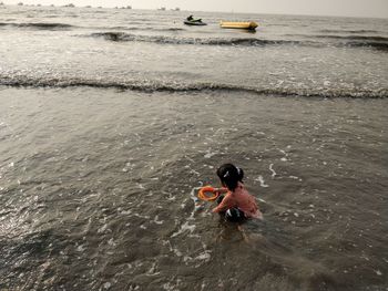 High angle view of man swimming in sea