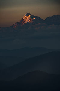 Scenic view of silhouette mountain against sky during sunset