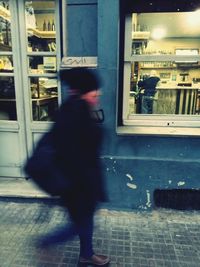 Rear view of woman walking in city