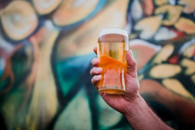 Close-up of hand holding drink