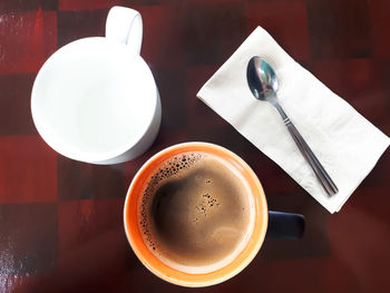 High angle view of coffee cup on table