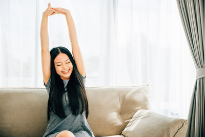 Young woman exercising at home
