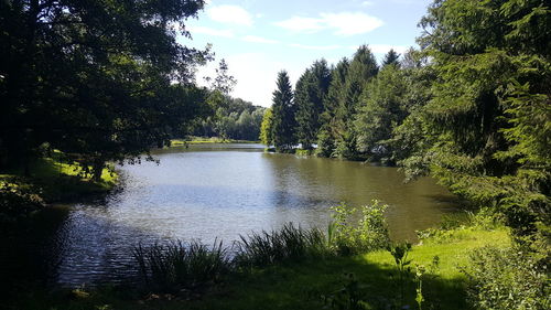 Scenic view of calm lake against sky