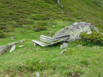 Abandoned bench on field